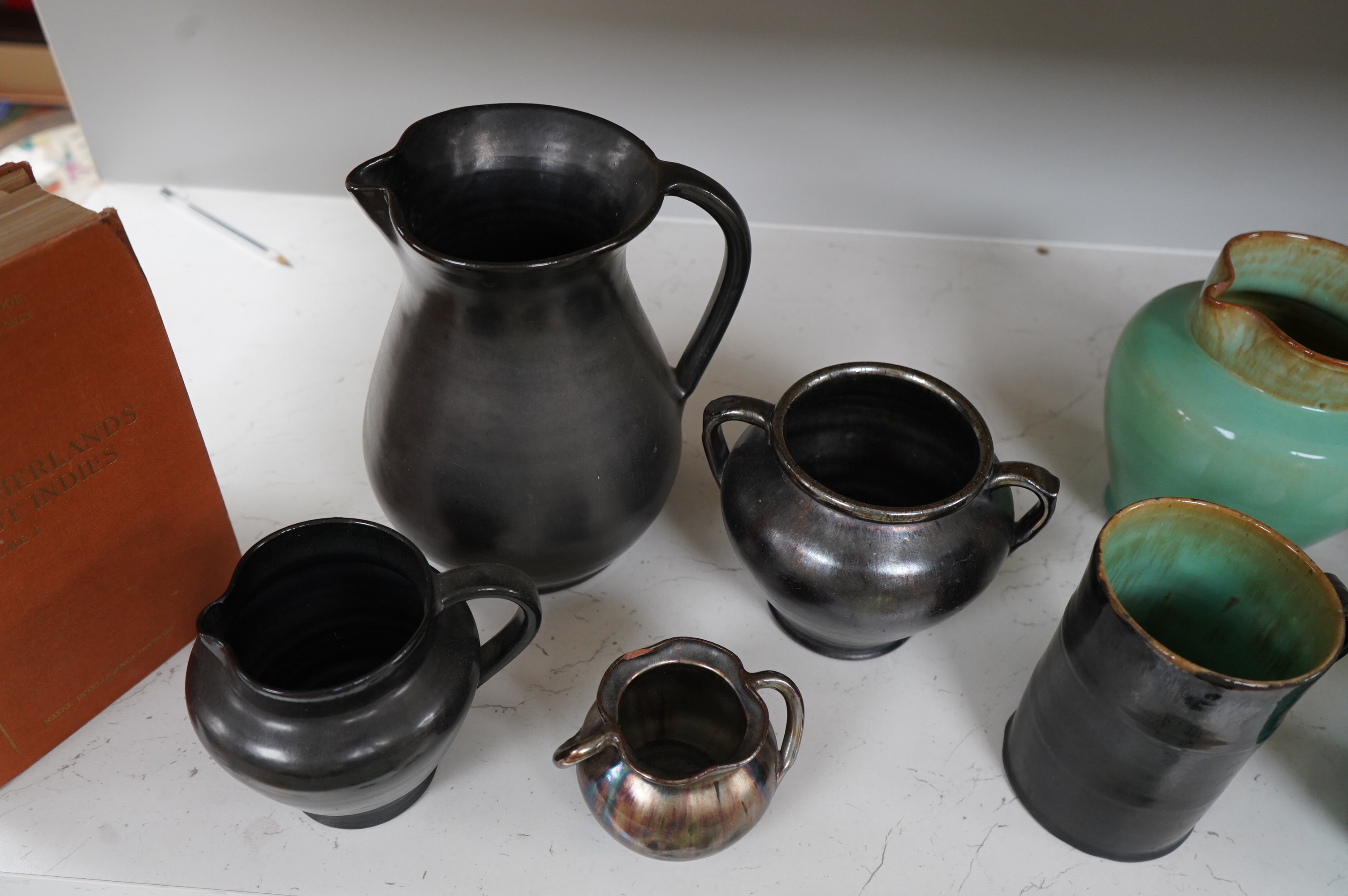 Ten items of Dickerware pottery, including a Uriah Clark and Nephew trio of connected jugs, tallest 21cm